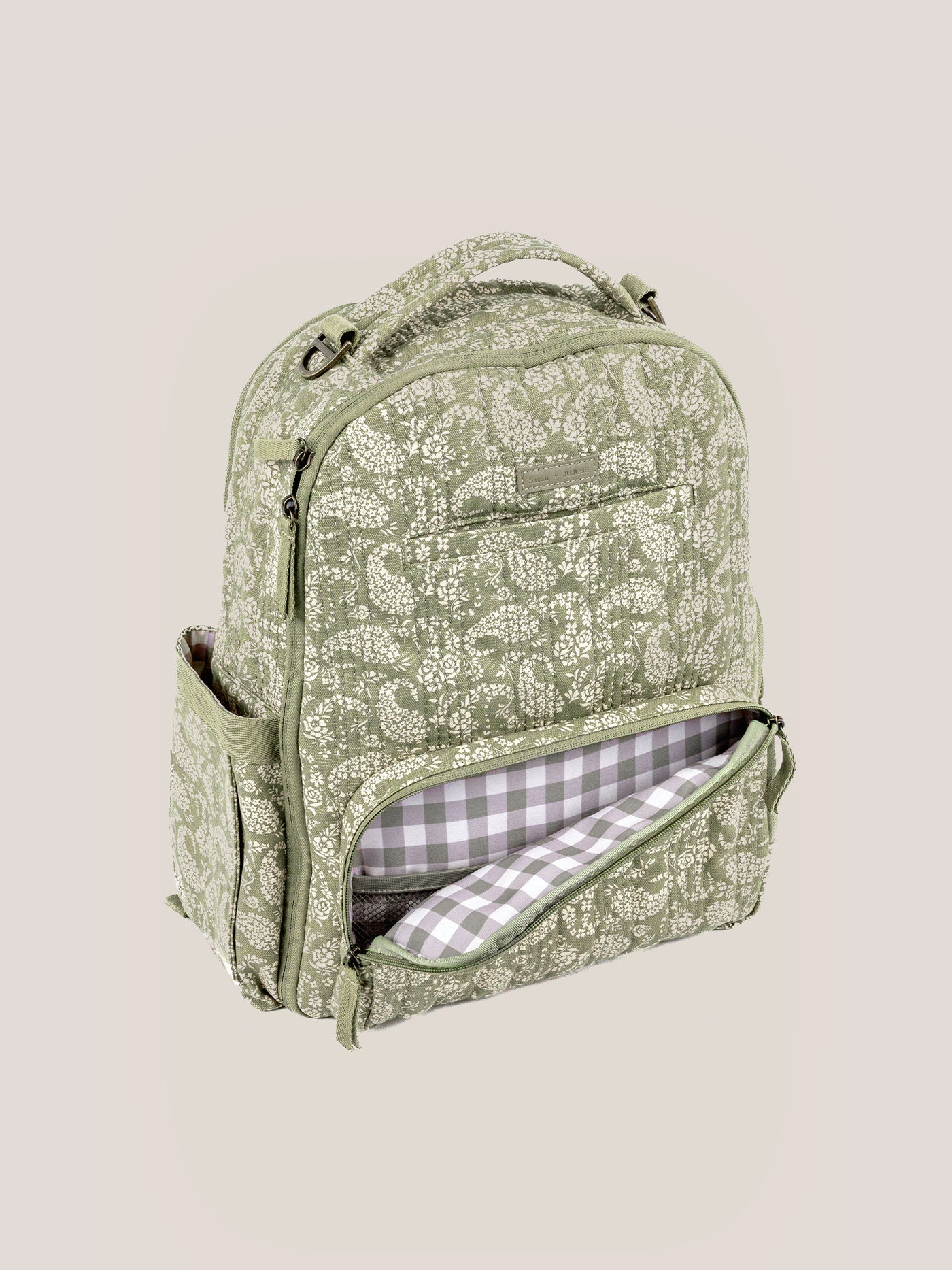 The Paisley Floral backpack, showing the hand-drawn print and gingham lining