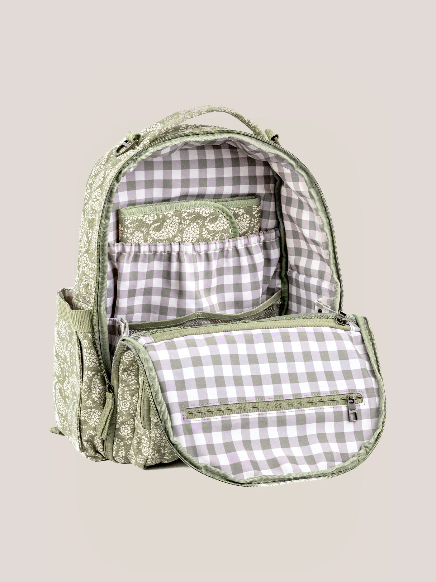 The removable cushioned changing pad, pulled out of the backpack
